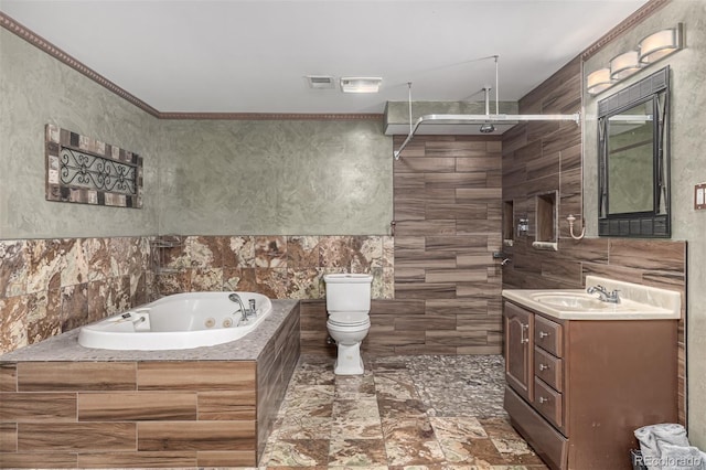 bathroom with visible vents, vanity, a tub with jets, tile walls, and walk in shower