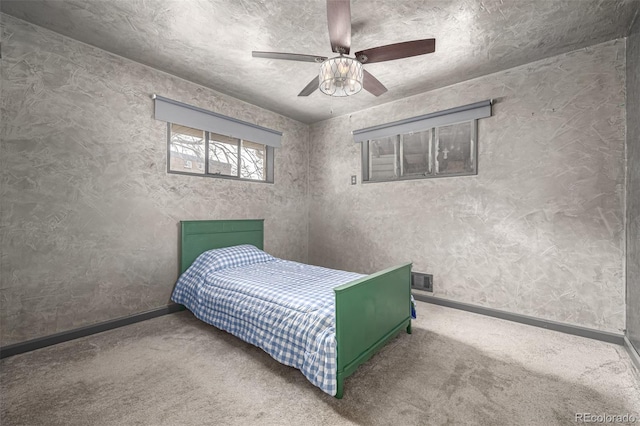 bedroom with baseboards, carpet floors, and ceiling fan