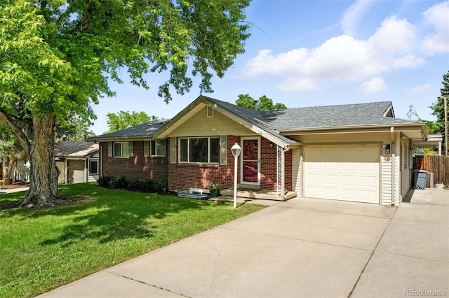 470 S Queen St, Lakewood, CO 80226 - ranch-style house with a garage, concrete driveway, brick siding, and roof with shingles