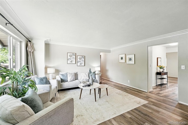 470 S Queen St, Lakewood, CO 80226 - living area with ornamental molding and wood finished floors