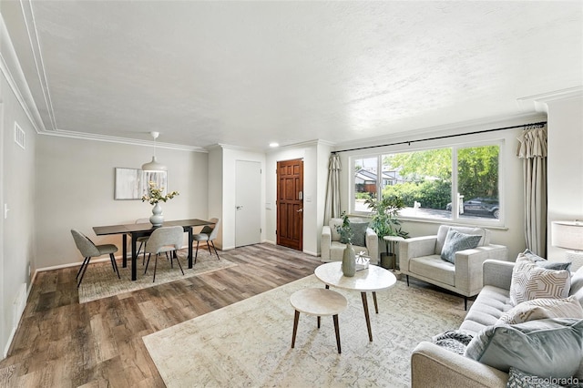 470 S Queen St, Lakewood, CO 80226 - living area featuring wood finished floors and crown molding