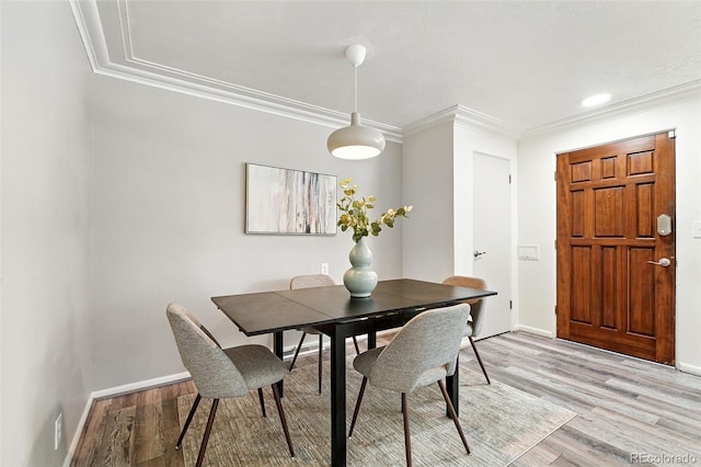 470 S Queen St, Lakewood, CO 80226 - dining room featuring light wood-type flooring and ornamental molding