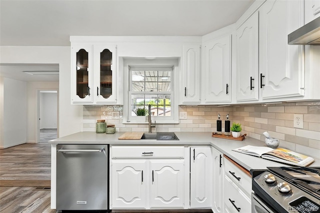 470 S Queen St, Lakewood, CO 80226 - kitchen featuring stainless steel appliances, white cabinets, tasteful backsplash, and glass insert cabinets