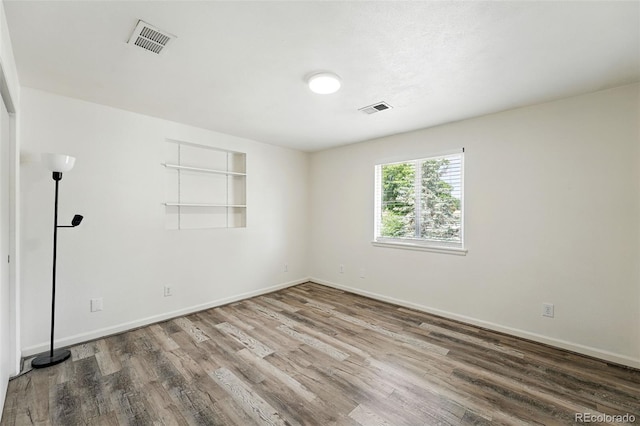 470 S Queen St, Lakewood, CO 80226 - empty room with wood finished floors and baseboards