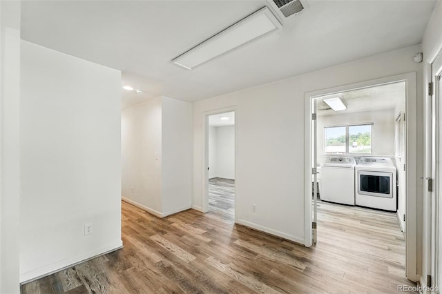 470 S Queen St, Lakewood, CO 80226 - spare room featuring washer and clothes dryer, light wood finished floors, attic access, and recessed lighting