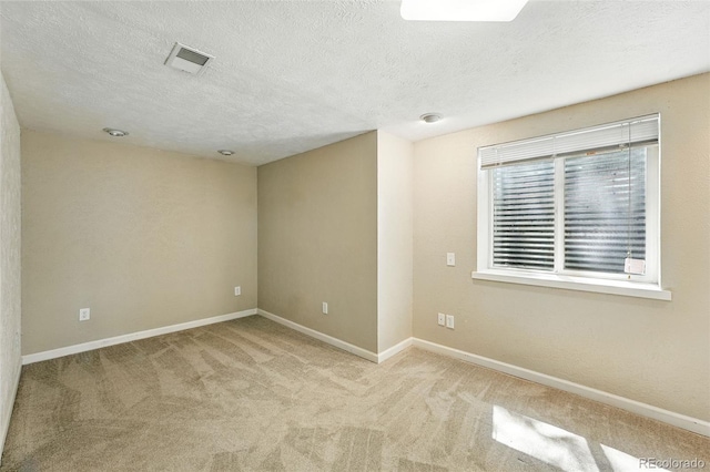 470 S Queen St, Lakewood, CO 80226 - carpeted spare room with baseboards and a textured ceiling