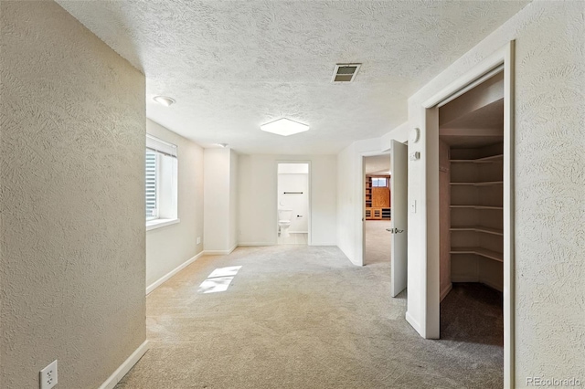 470 S Queen St, Lakewood, CO 80226 - hallway featuring a textured wall, carpet floors, and a textured ceiling