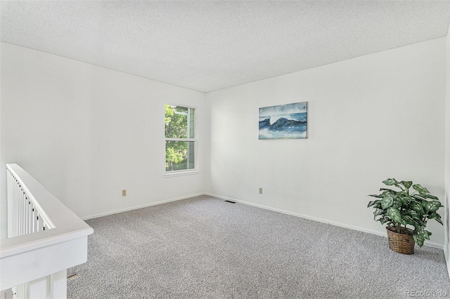480 W Rockrimmon Blvd Unit D, Colorado Springs, CO 80919 - carpeted empty room with a textured ceiling and baseboards