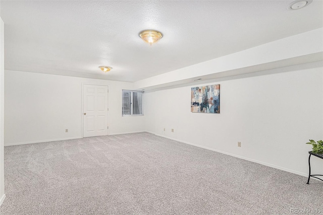 480 W Rockrimmon Blvd Unit D, Colorado Springs, CO 80919 - carpeted spare room featuring baseboards and a textured ceiling