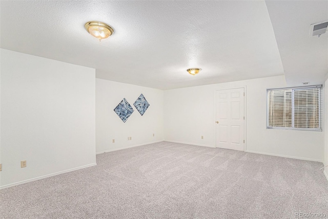 480 W Rockrimmon Blvd Unit D, Colorado Springs, CO 80919 - spare room featuring light carpet, a textured ceiling, and baseboards