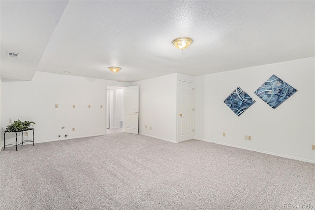 480 W Rockrimmon Blvd Unit D, Colorado Springs, CO 80919 - unfurnished room featuring light carpet, a textured ceiling, and baseboards