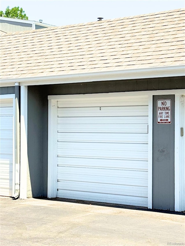 1160 S Monaco Pkwy Unit 6, Denver, CO 80224 - garage featuring driveway
