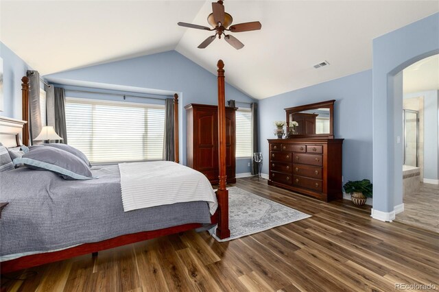 bedroom with arched walkways, a ceiling fan, vaulted ceiling, visible vents, and wood finished floors