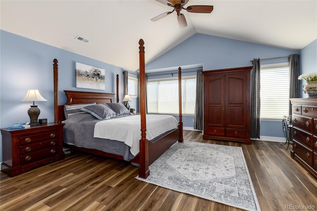 bedroom featuring visible vents, baseboards, a ceiling fan, dark wood-style floors, and lofted ceiling