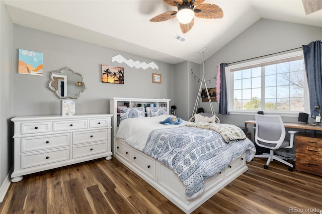 bedroom featuring dark wood-type flooring, visible vents, vaulted ceiling, and a ceiling fan