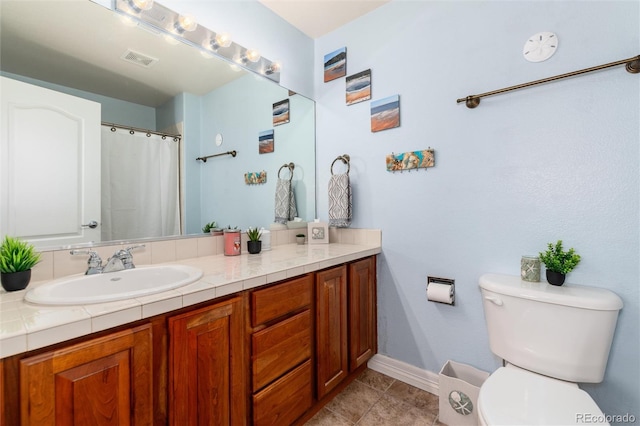 full bathroom featuring vanity, baseboards, tile patterned floors, toilet, and visible vents