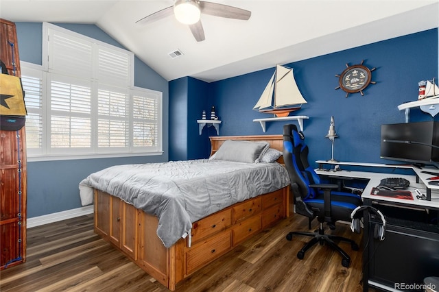bedroom featuring visible vents, baseboards, ceiling fan, wood finished floors, and vaulted ceiling