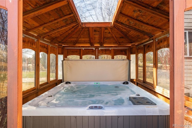 unfurnished sunroom with a jacuzzi
