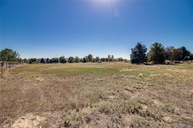 view of yard with a rural view