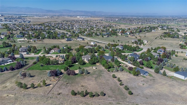 drone / aerial view featuring a mountain view and a residential view