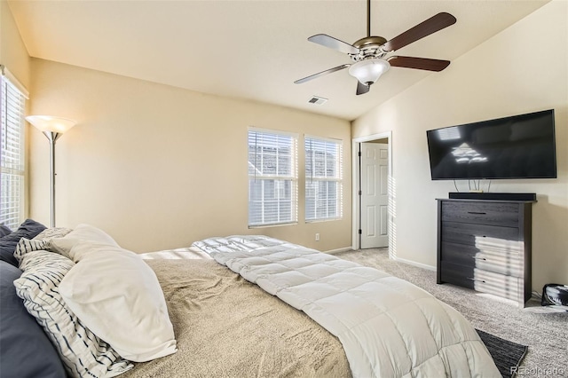 carpeted bedroom featuring ceiling fan and vaulted ceiling