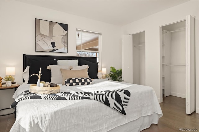 bedroom featuring dark wood-style floors and a closet