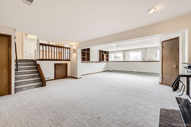 unfurnished living room with stairs, carpet floors, visible vents, and a baseboard heating unit