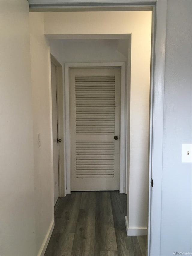 6411 W 82nd Dr, Arvada, CO 80003 - corridor with dark wood-style flooring and baseboards