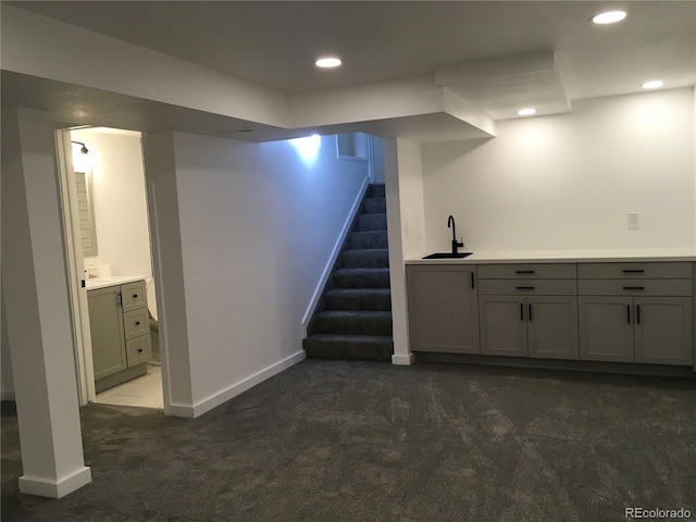 6411 W 82nd Dr, Arvada, CO 80003 - finished below grade area with a sink, carpet flooring, baseboards, recessed lighting, and stairs