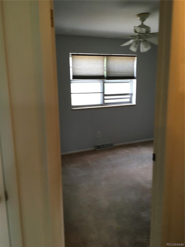 6411 W 82nd Dr, Arvada, CO 80003 - spare room with carpet flooring, baseboards, and a ceiling fan