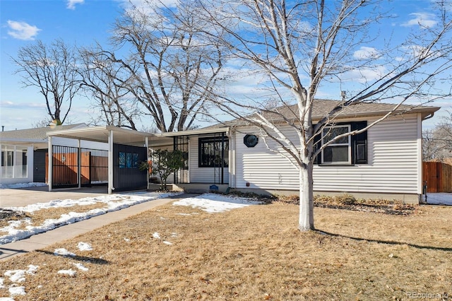 view of front of property with a carport