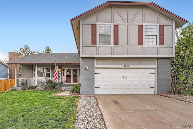 view of front facade with covered porch, driveway, a garage, brick siding, and a front lawn