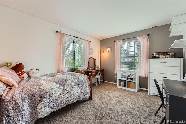 carpeted bedroom with baseboards