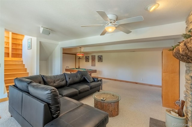 living room with ceiling fan, built in features, a textured ceiling, and pool table