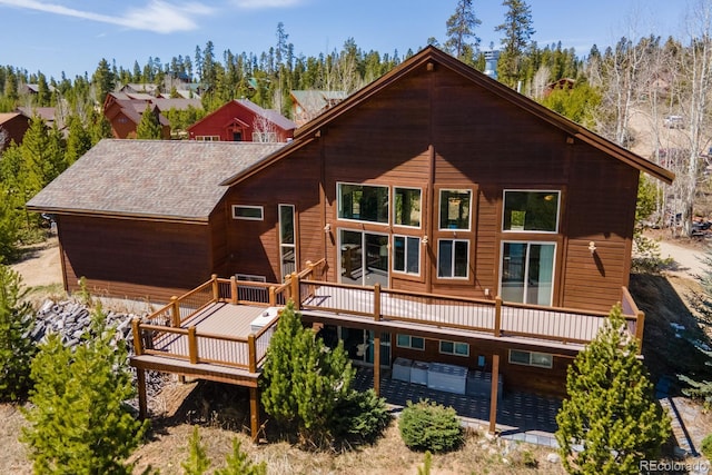 385 Trail Ridge Dr, Grand Lake, CO 80447 - back of house featuring a shingled roof, a patio, and a wooden deck