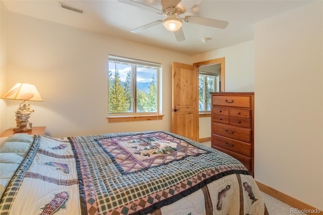 385 Trail Ridge Dr, Grand Lake, CO 80447 - carpeted bedroom with baseboards, a ceiling fan, and visible vents