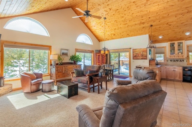 living area with wine cooler, light tile patterned floors, a ceiling fan, wood ceiling, and high vaulted ceiling