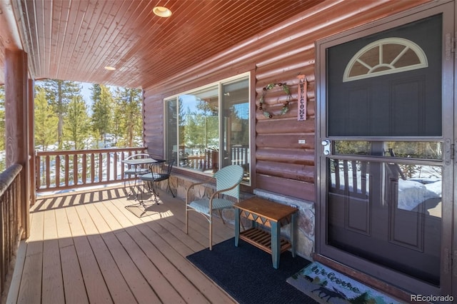 wooden terrace with a porch