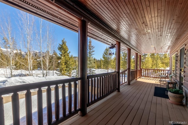 view of snow covered deck