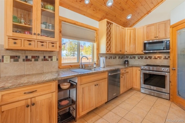 kitchen featuring decorative backsplash, lofted ceiling, wooden ceiling, stainless steel appliances, and light brown cabinets