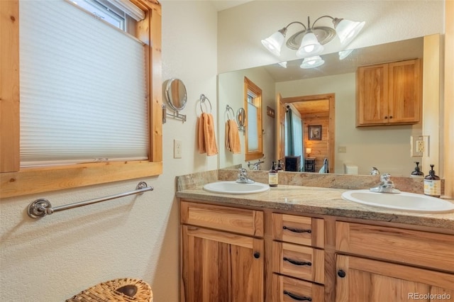 bathroom featuring double vanity and a sink