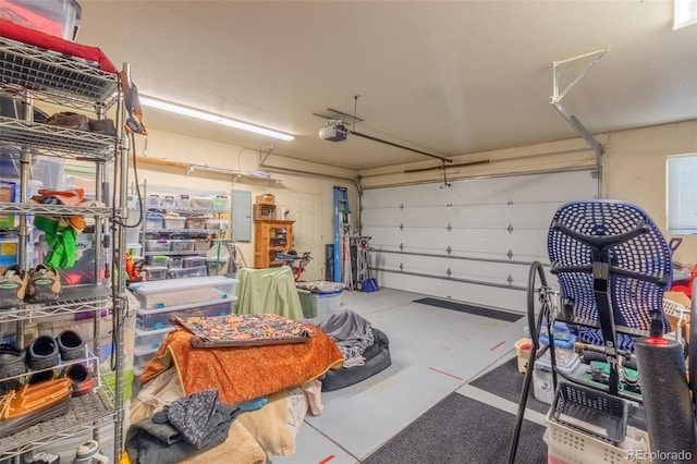 garage with electric panel and a garage door opener