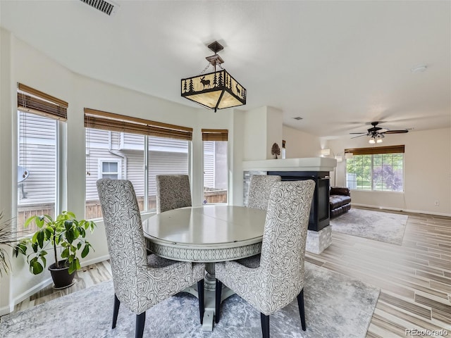 dining room featuring ceiling fan and light hardwood / wood-style flooring