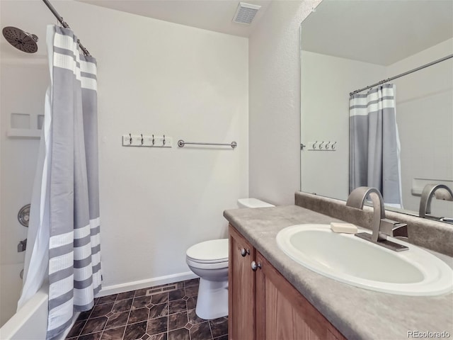 full bathroom featuring tile patterned flooring, shower / tub combo, vanity, and toilet