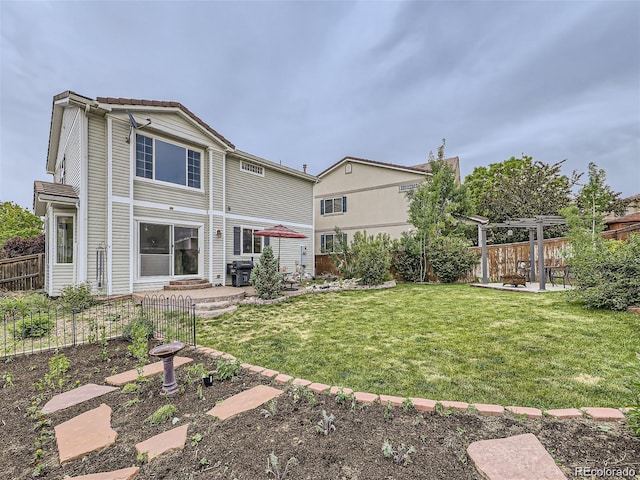 rear view of property with a lawn