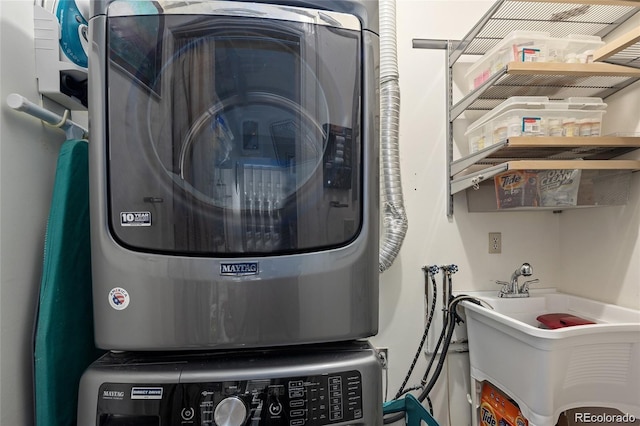 interior space featuring laundry area and stacked washer / drying machine