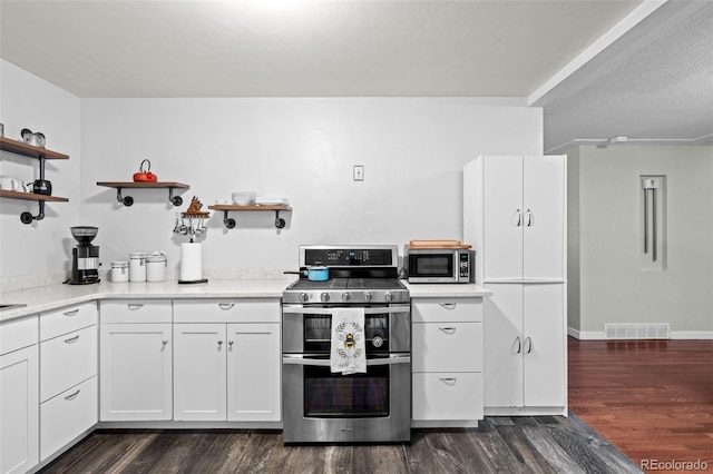 kitchen featuring open shelves, appliances with stainless steel finishes, dark wood-style flooring, and visible vents