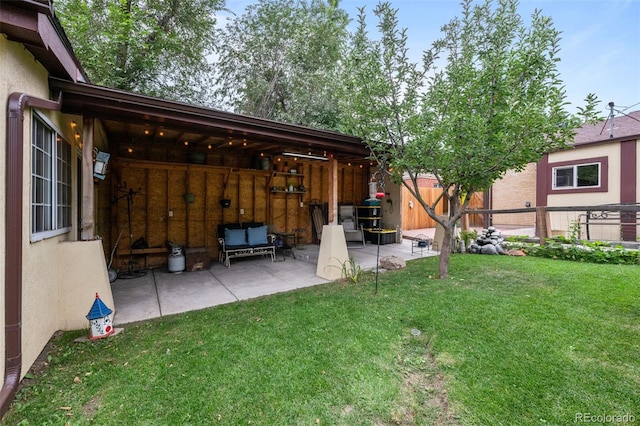 view of yard featuring a patio and fence