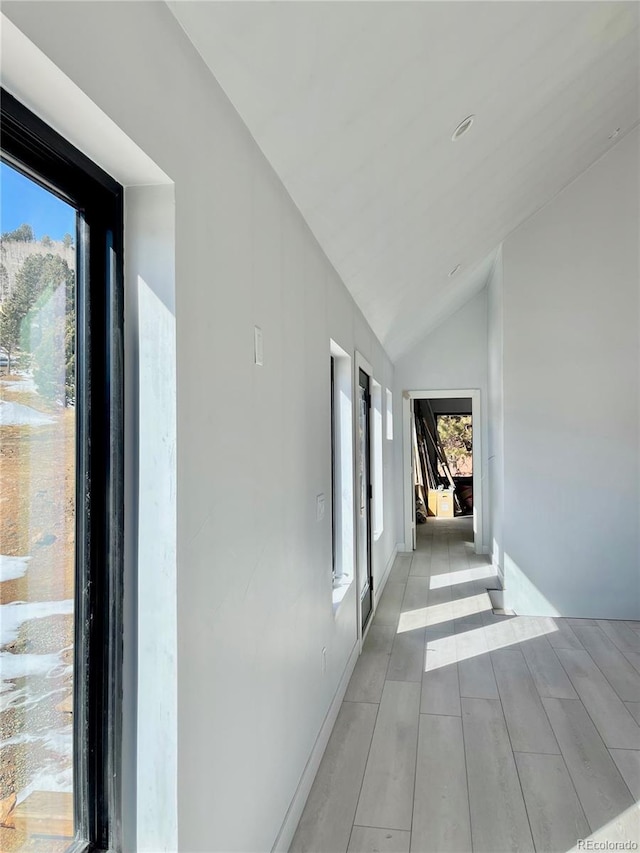 hallway with vaulted ceiling