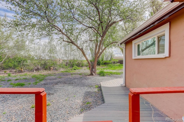 view of yard with a deck